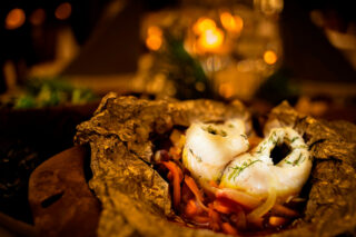 A delicious dish and soft mood lighting in Arctic Giant restaurant Makuhelmi