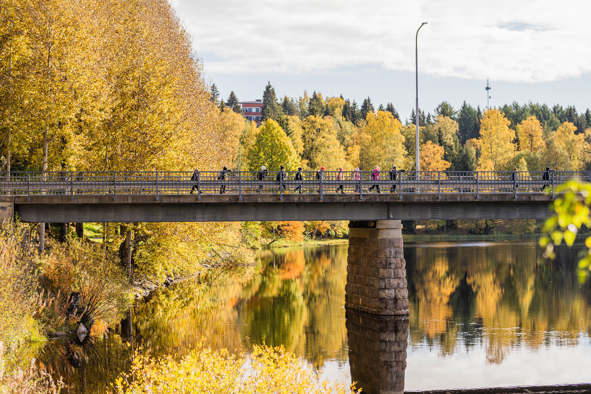 Kids walking across the bridge